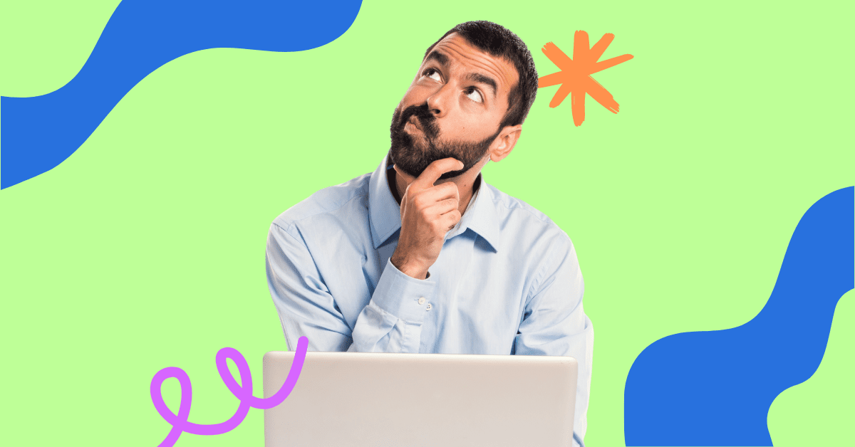 A man in a blue shirt sitting in front of a laptop, thinking about his product demo video.