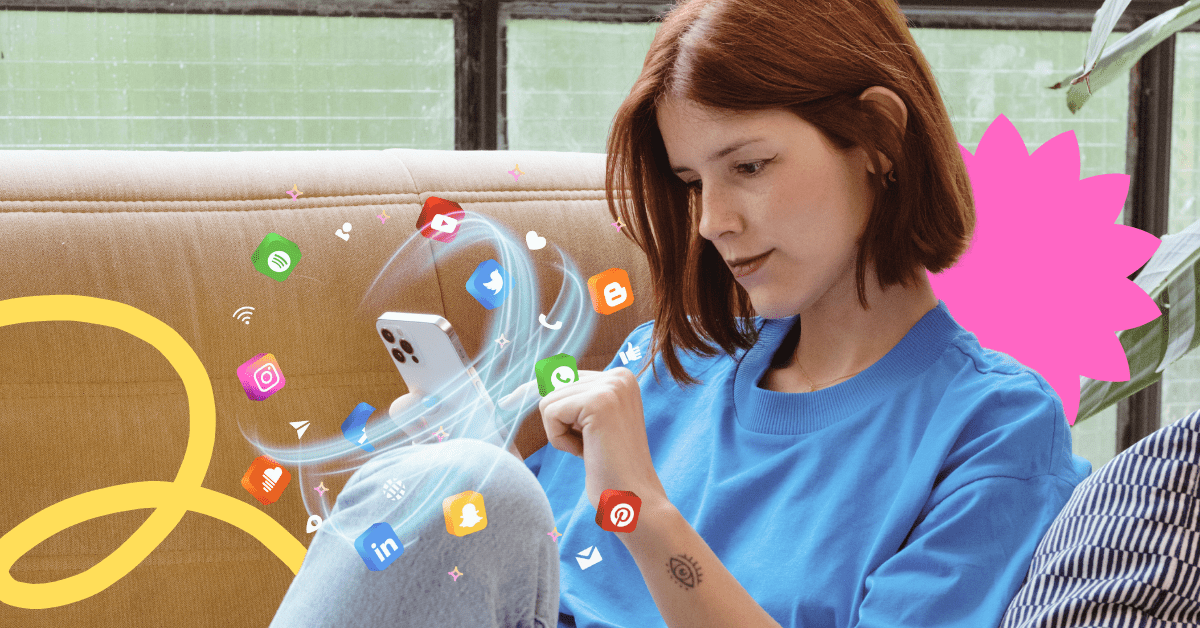 A woman with short brown hair wearing a blue t-shirt is using her mobile phone