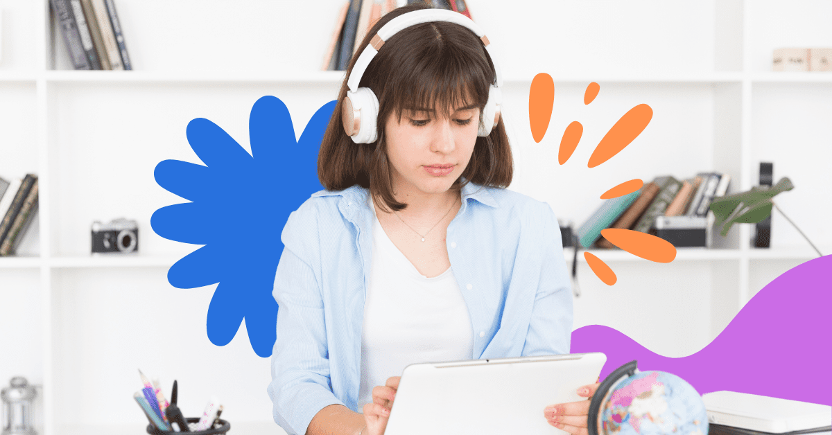 A woman with short brown hair wearing headphones looking at a tablet screen